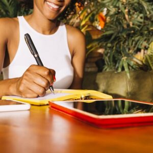 young woman writing diary